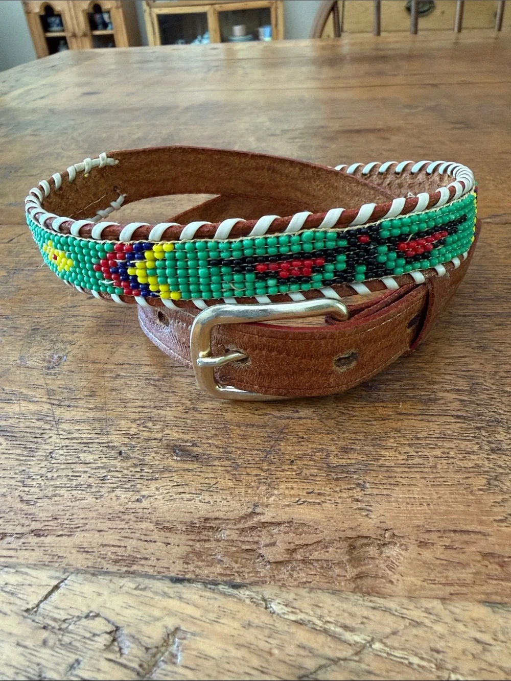 Child’s souvenir beaded belt with brown leather